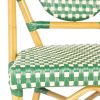 Green rattan chairs and stools.