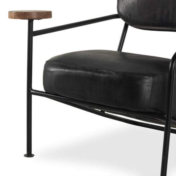 Black leather armchairs.