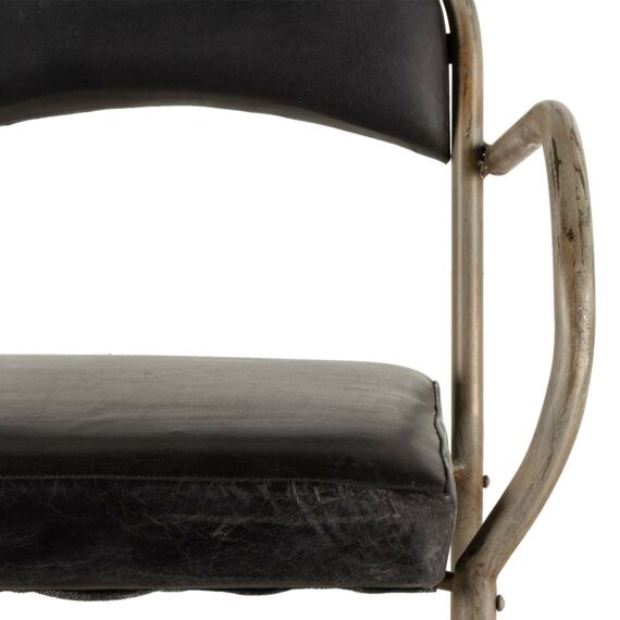 Upholstered chairs with arms.